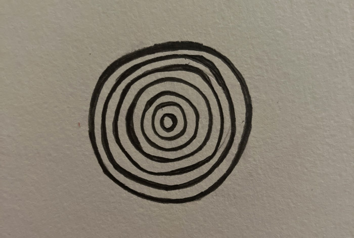 black concentric circles painted on paper